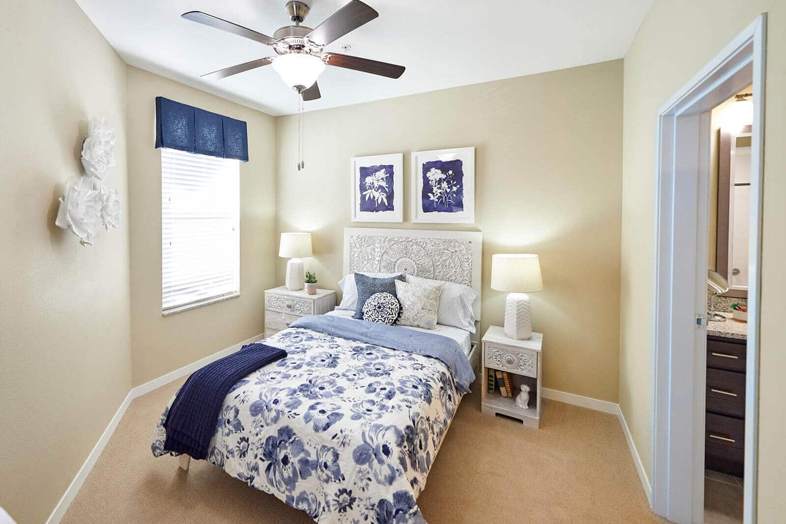 bedroom with blue and white bedspread