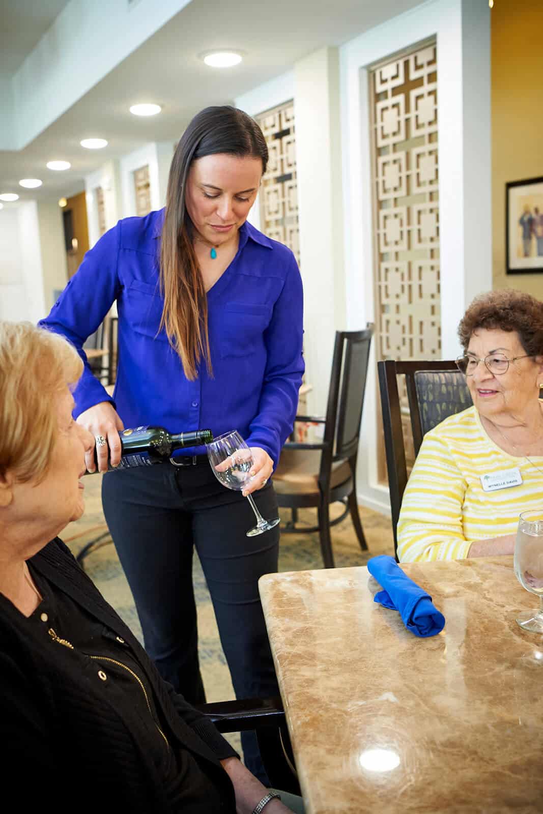 Employee pouring wine at Park Creek