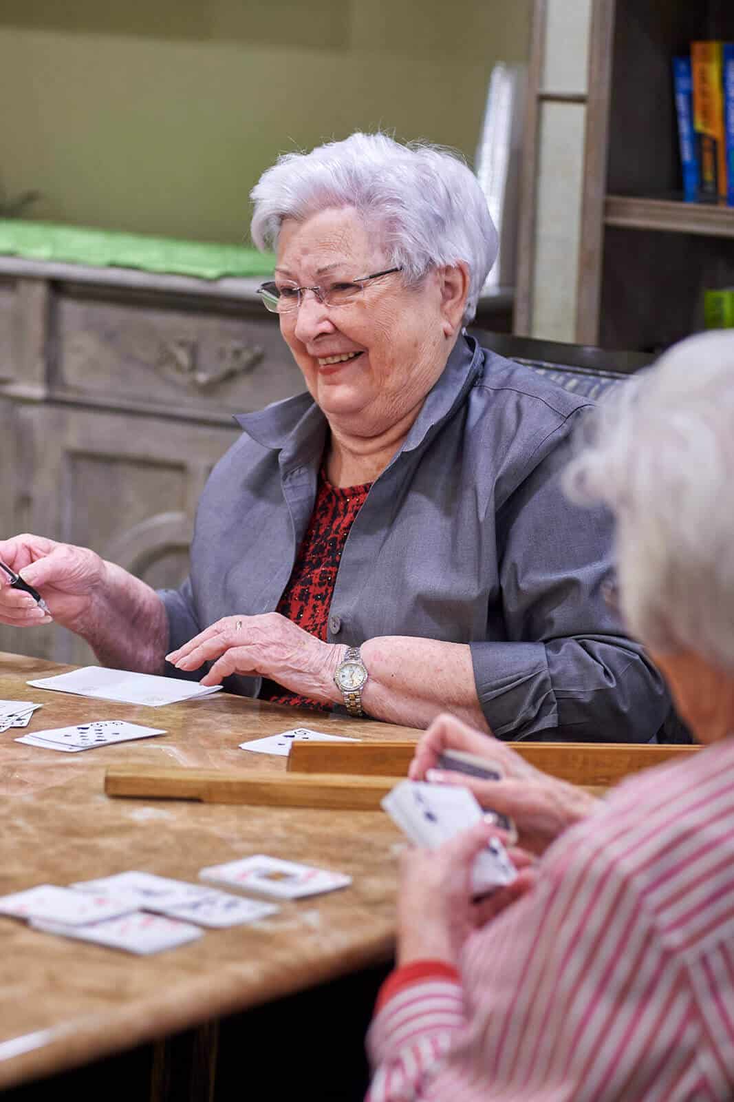 Residents playing cards at Park Creek