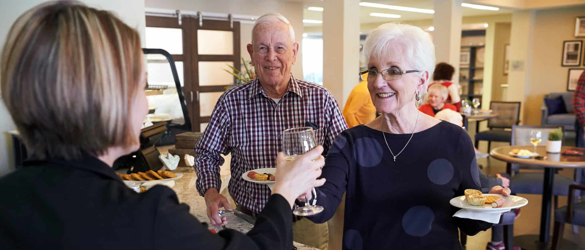 Residents enjoying wine and socializing