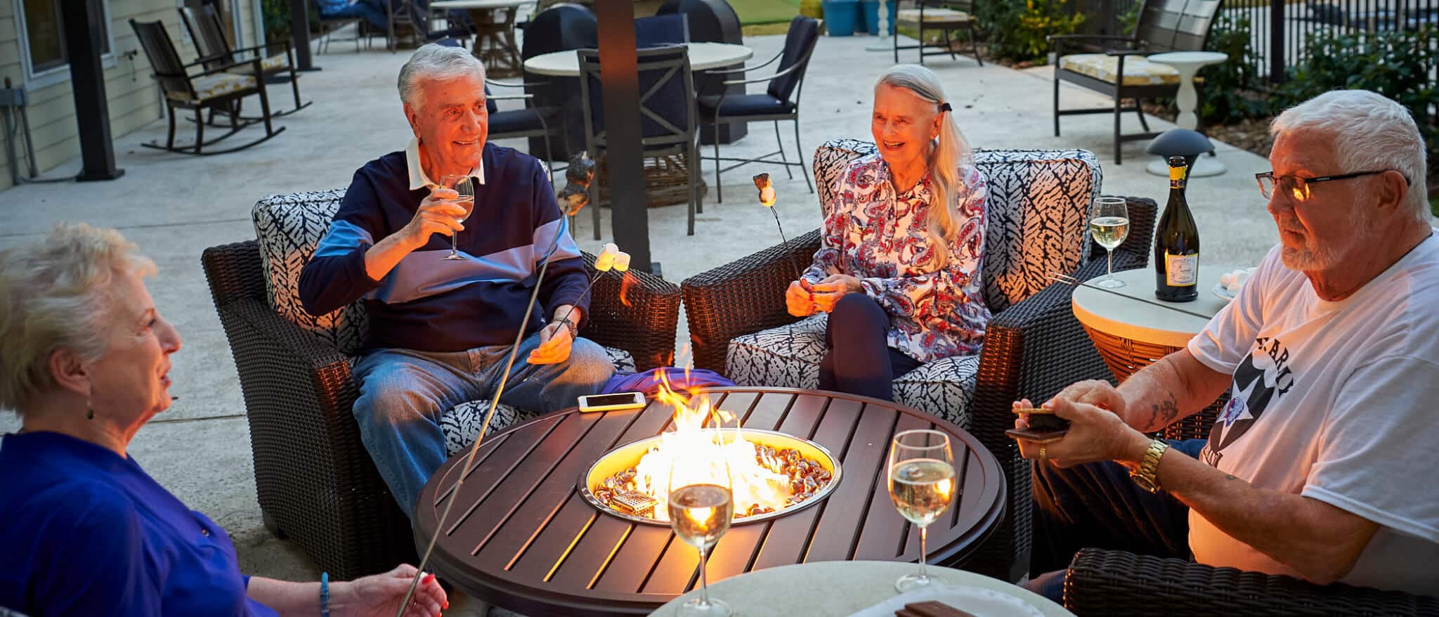 Residents roasting marshmallows on the patio