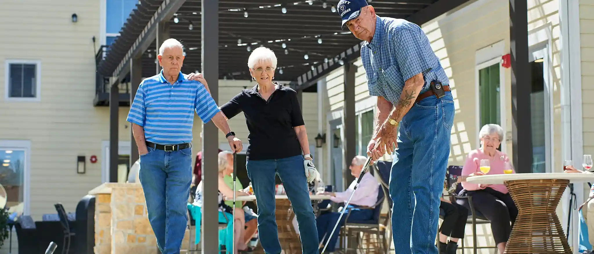 friends golfing in the courtyard at park creek